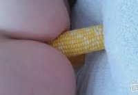 woman fucks herself with corn