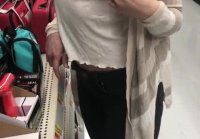 Sexy woman flashing in shop