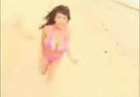 Asian Ourei Harada models a pink bikini