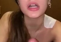 Beautiful and young girl jerks off dick and sucks