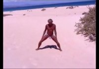 Tanned guy on beach in tiny string thong (temporarily!)