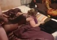 Fucking with a friend on a marital bed