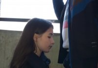 Young girl sucks and takes cum in her mouth on the balcony