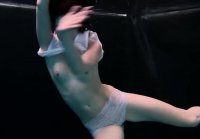 Flexible swimmer Andreika gracefully swims naked underwater