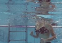 Sima shows all her charms while playing underwater