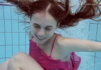 Funny and playful Anna swims underwater in negligee and thong