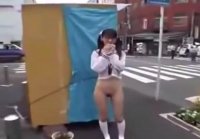 Japanese exhibitionist with butt out in streets