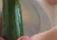 Fingering his pussy with a cucumber in the toilet