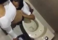 Cunnilingus in the toilet of a for a chick from her friend