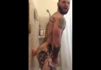 Tatted Hunk Fucks Dildo in Shower Until He Cums