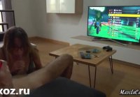 While the guy plays the console, the cute stepsister sucks a dick