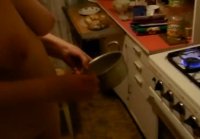 Wife cooks in the kitchen naked