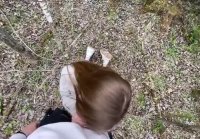 A young girl worked with her mouth in the forest in the fresh air