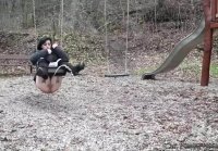 Rides on a swing and pisses